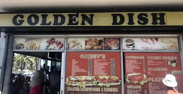The old Golden Dish sign above the Gatesville shop, with its red menu boards